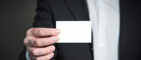 Image of a hand holding a business card